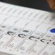 A Filipino woman puts her fingerprint in a registration book after casting her vote at a polling station in Hong Kong April 10, 2010. Filipinos based in Hong Kong began voting on Saturday in the Philippines' national election. About 96,000 registered voters in Hong Kong will take part in the month-long voting process. REUTERS/Tyrone Siu (CHINA - Tags: POLITICS ELECTIONS) - RTR2CMTL